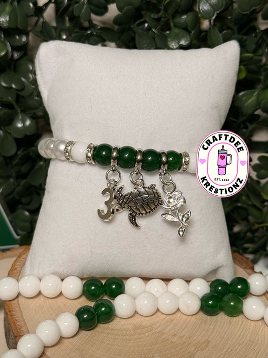 Iota Bracelet w/Charms